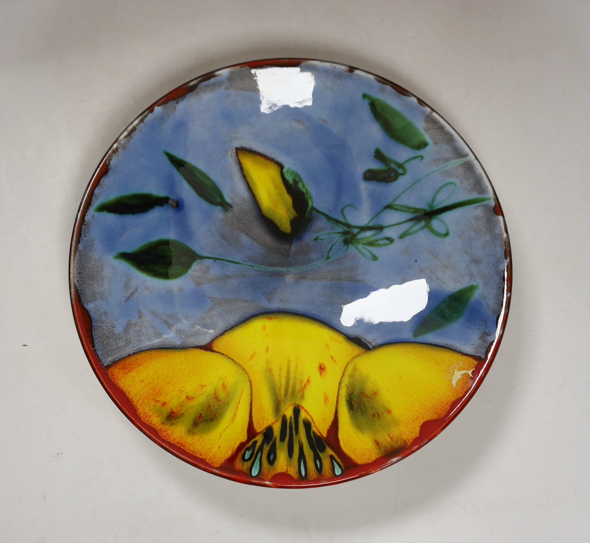 Three Poole Pottery ‘Delphis’ wall plates, 25cm